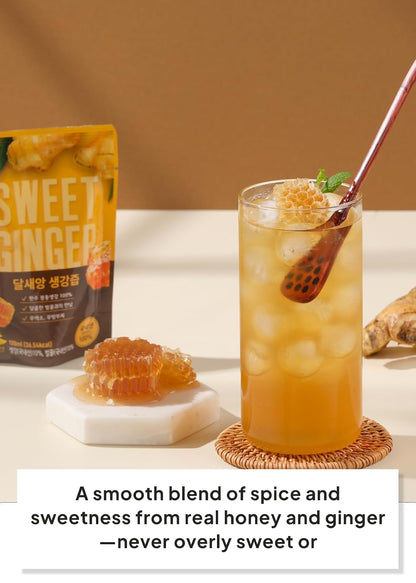A glass of iced ginger drink with ice and a honeycomb piece on a coaster, next to a small dish of honey and a stand-up pouch labeled Dalsaeang Sweet Ginger, with a text banner at the bottom.