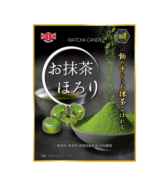 The front of the package of Nissin Matcha Horori Candy in front of a white background. Package has a bowl of matcha powder, and a close-up of a piece of the candy split in half to show the smooth outer layer and powder inside. 